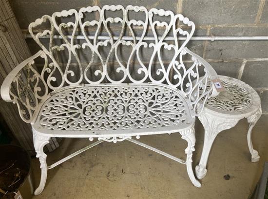 A painted cast aluminium garden bench, width 95cm, together with a circular table